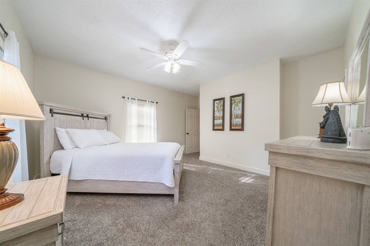 Luxurious linens and pillows atop a wonderful comfortable mattress. You will get a great nights sleep in here.   -Queen Bedroom (1of2) from shared bathroom.