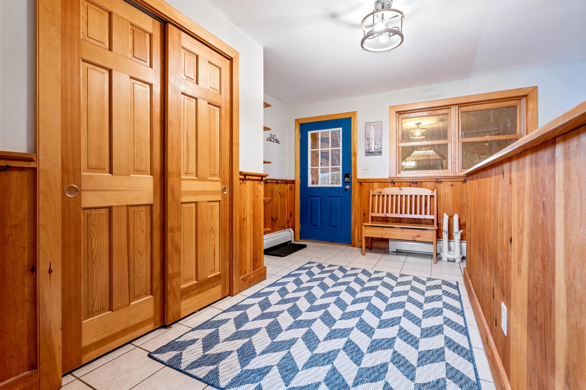 Step inside to a warm, welcoming entryway that instantly sets the tone for a relaxed group retreat.