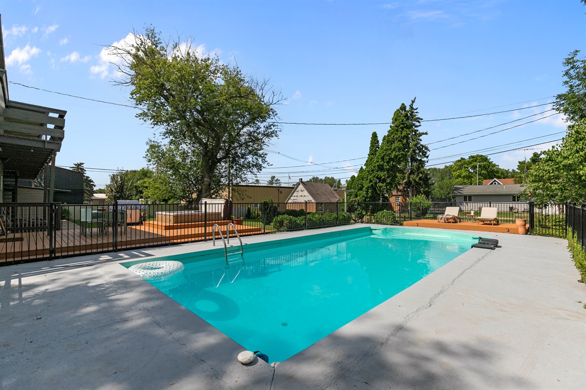 The large fenced-in pool area offers both fun and peace of mind, giving you plenty of space to relax, play, and enjoy the water safely.
