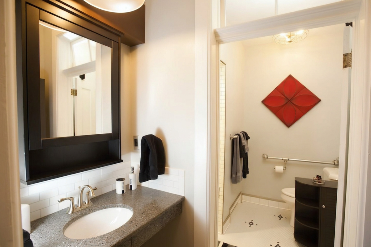 Plantera bathroom’s mirrored cabinet offers storage space for toiletries and door closes to shower and toilet