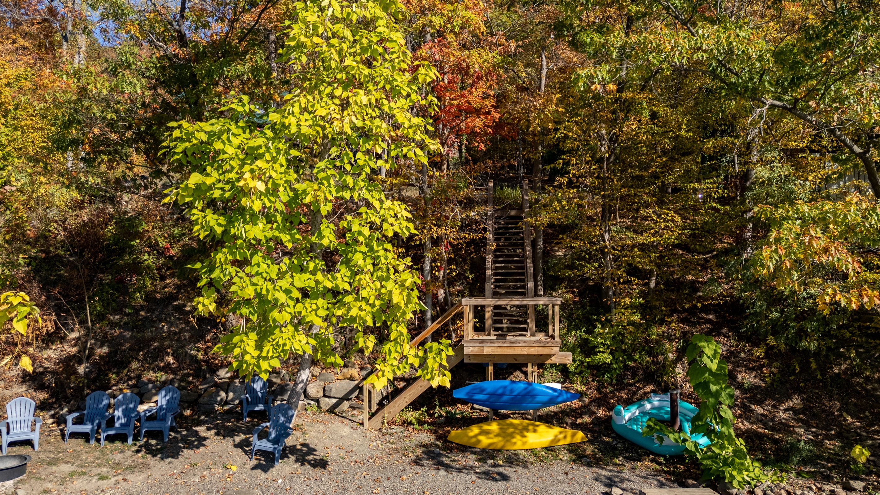 Golden leaves frame this cozy lakeside spot, complete with a private dock for swimming or kayaking.