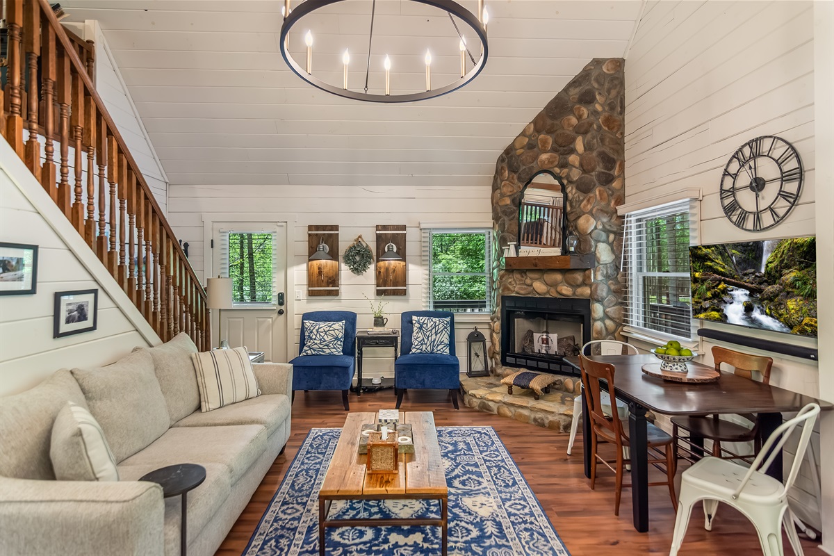 Open concept main room with views of the loft and fireplace to enjoy the HD TV with sound bar.