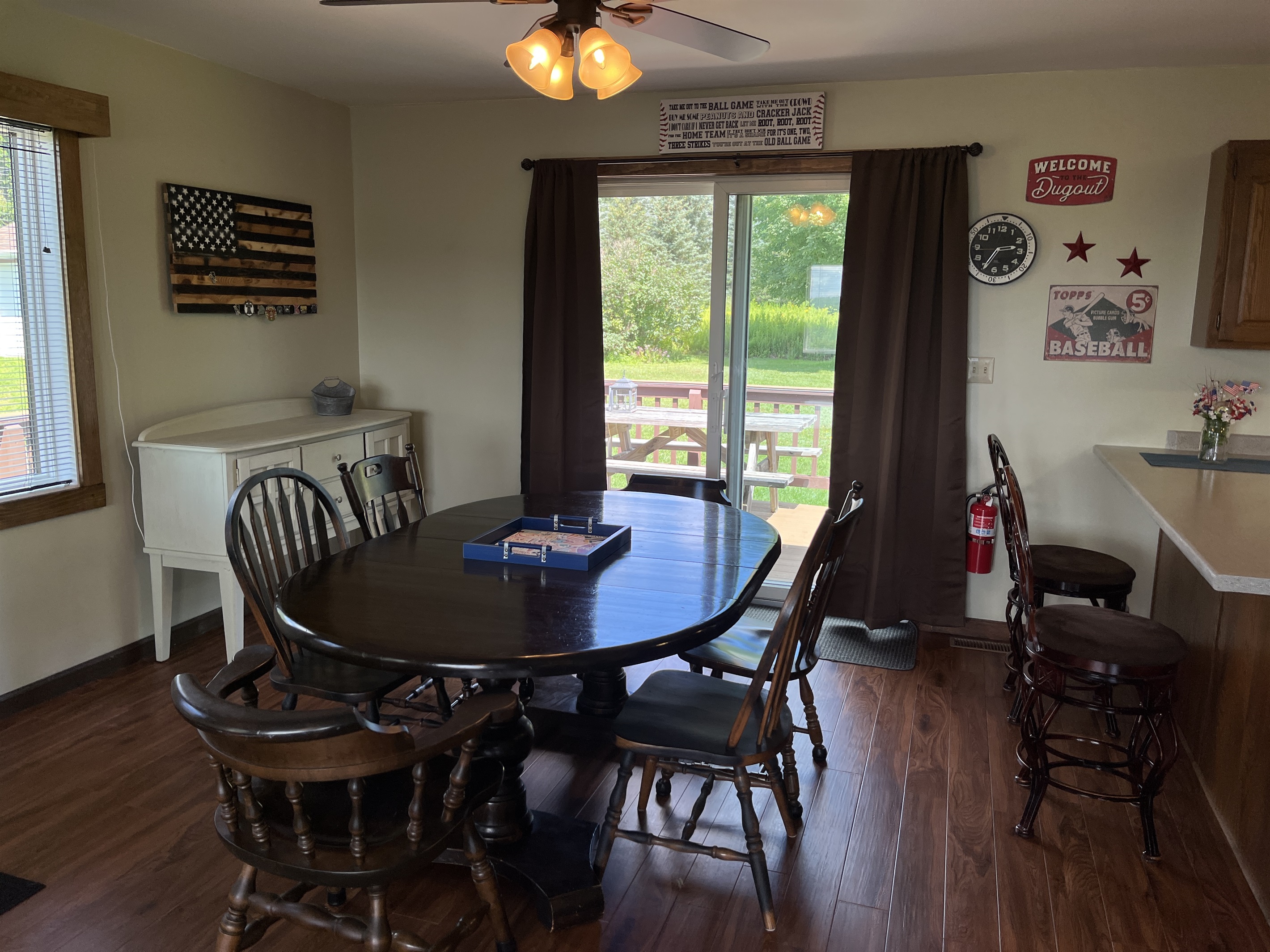 Dining area with sliders to deck and picnic table
