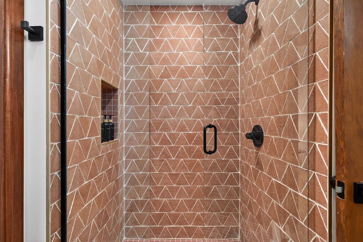 Bathroom 3- Refresh in a beautifully tiled walk-in shower featuring stylish finishes and a clean, modern feel. (Downstairs)
