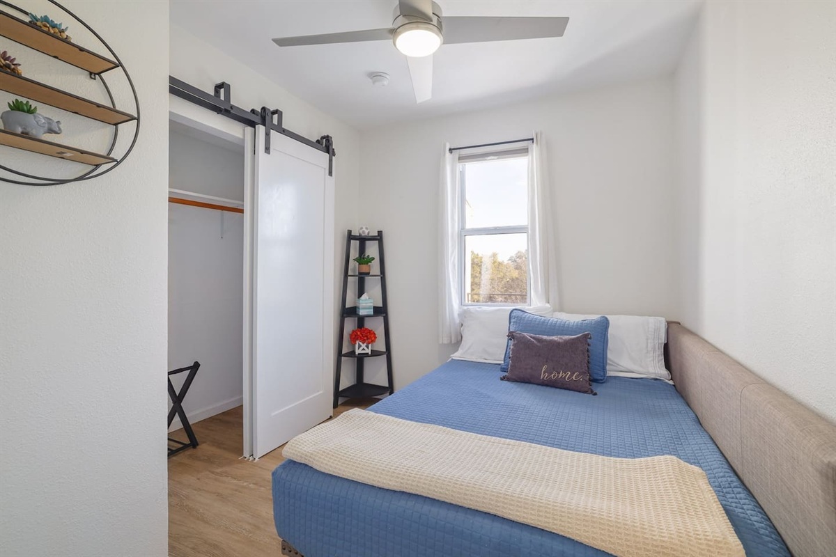 Tucked upstairs for added privacy, this cozy double bedroom offers a calm retreat with soft natural light and thoughtful touches throughout. A comfortable space to unwind and recharge after a full day together.