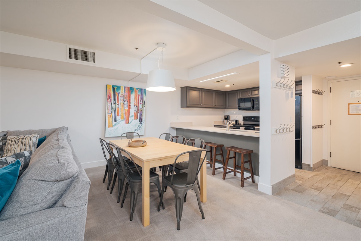 Large Dining Table next to Kitchen & Entrance
