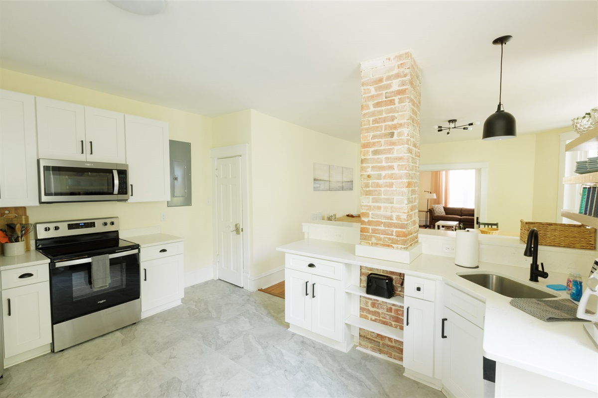 Spacious kitchen with modern appliances, essentials.