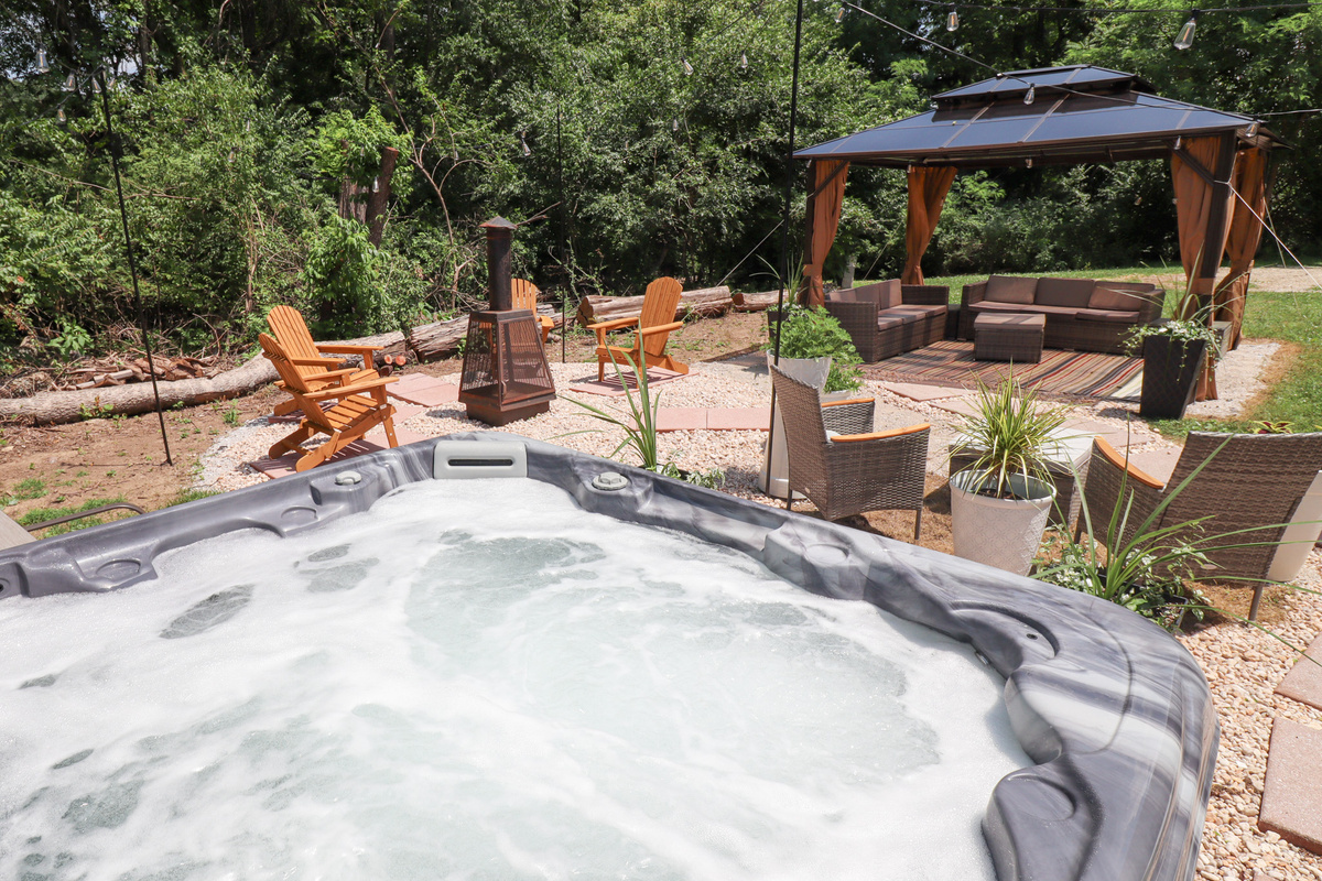 Private backyard oasis is designed for relaxing, gathering, and making memories