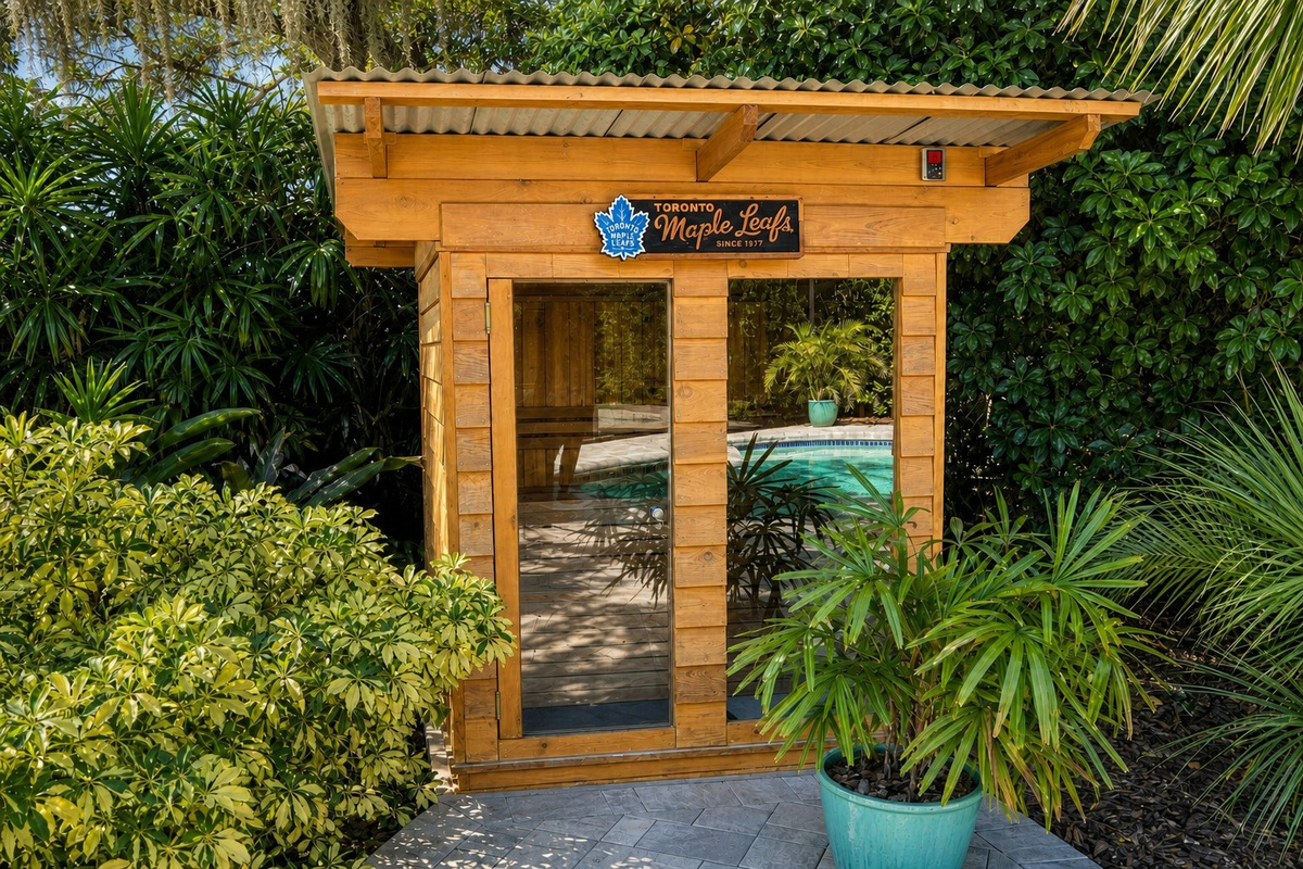 Luxurious outdoor sauna surrounded by lush tropical greenery.
