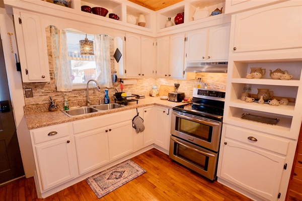 Fully stocked, family-friendly kitchen with modern appliances, plenty of counter space, and everything you need to cook meals or snacks together after a day of exploring Pigeon Forge.