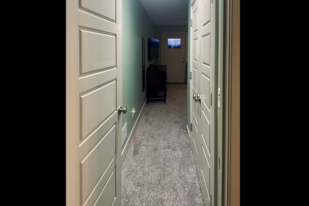 Inviting entry to the primary suite with convenient closet access and a quiet, private retreat feel.