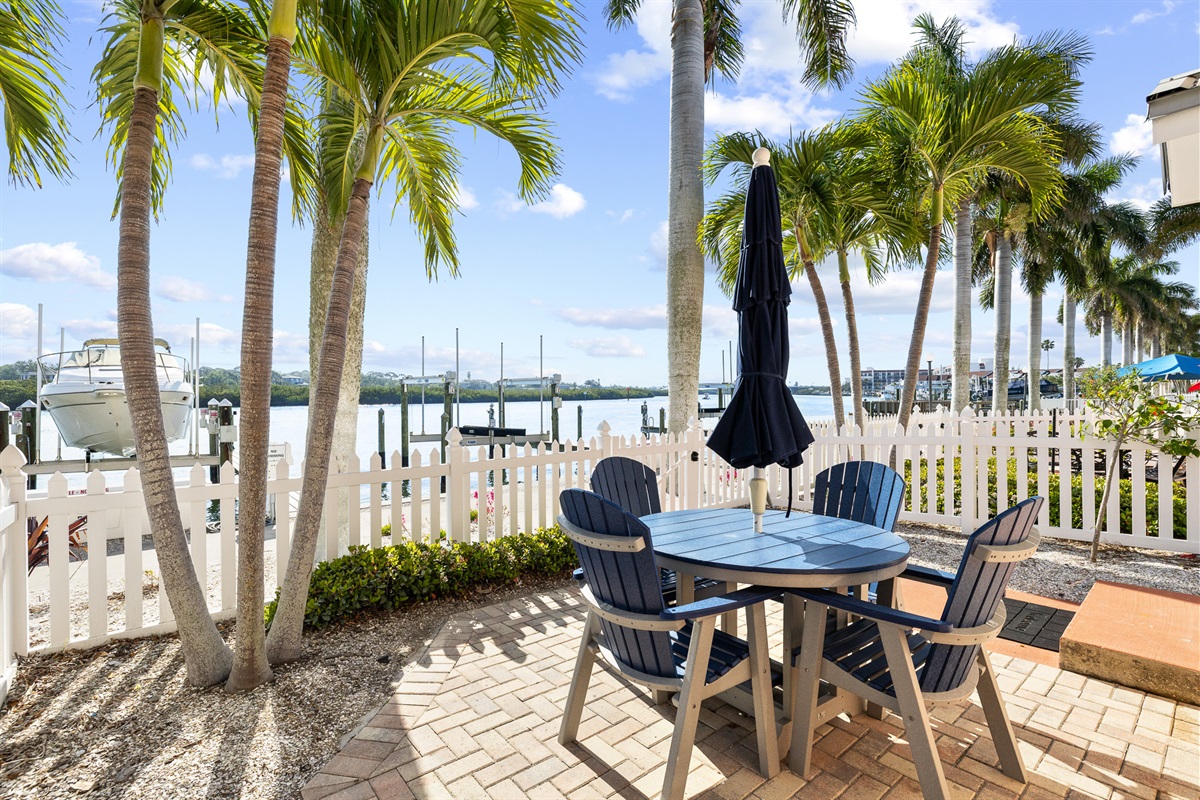 The private waterfront courtyard is accessed through the back door of the unit