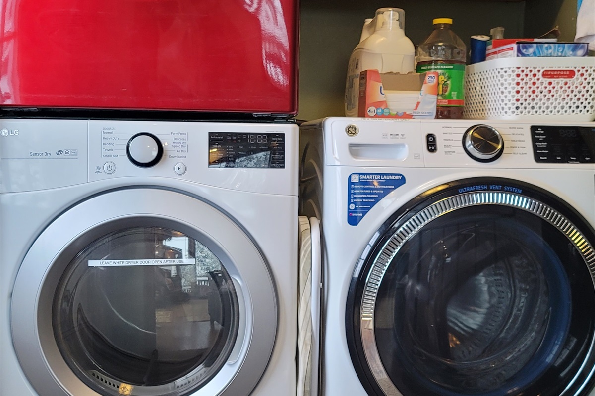 Front loading Washing machine and 2 Clothes Dryers, laundry supplies are provided.  The Electrical Panel is in this room.
