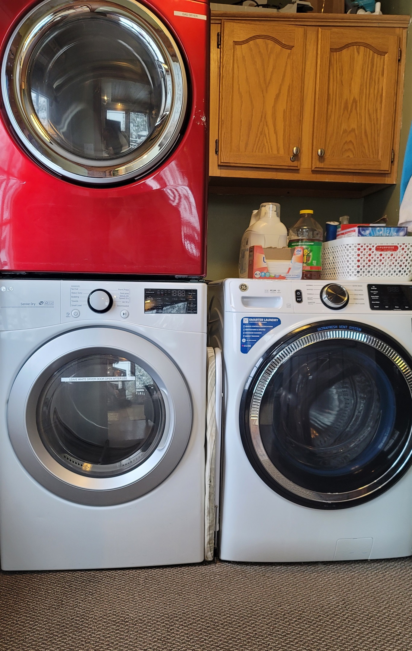 Front loading Washing machine and 2 Clothes Dryers, laundry supplies are provided.  The Electrical Panel is in this room.