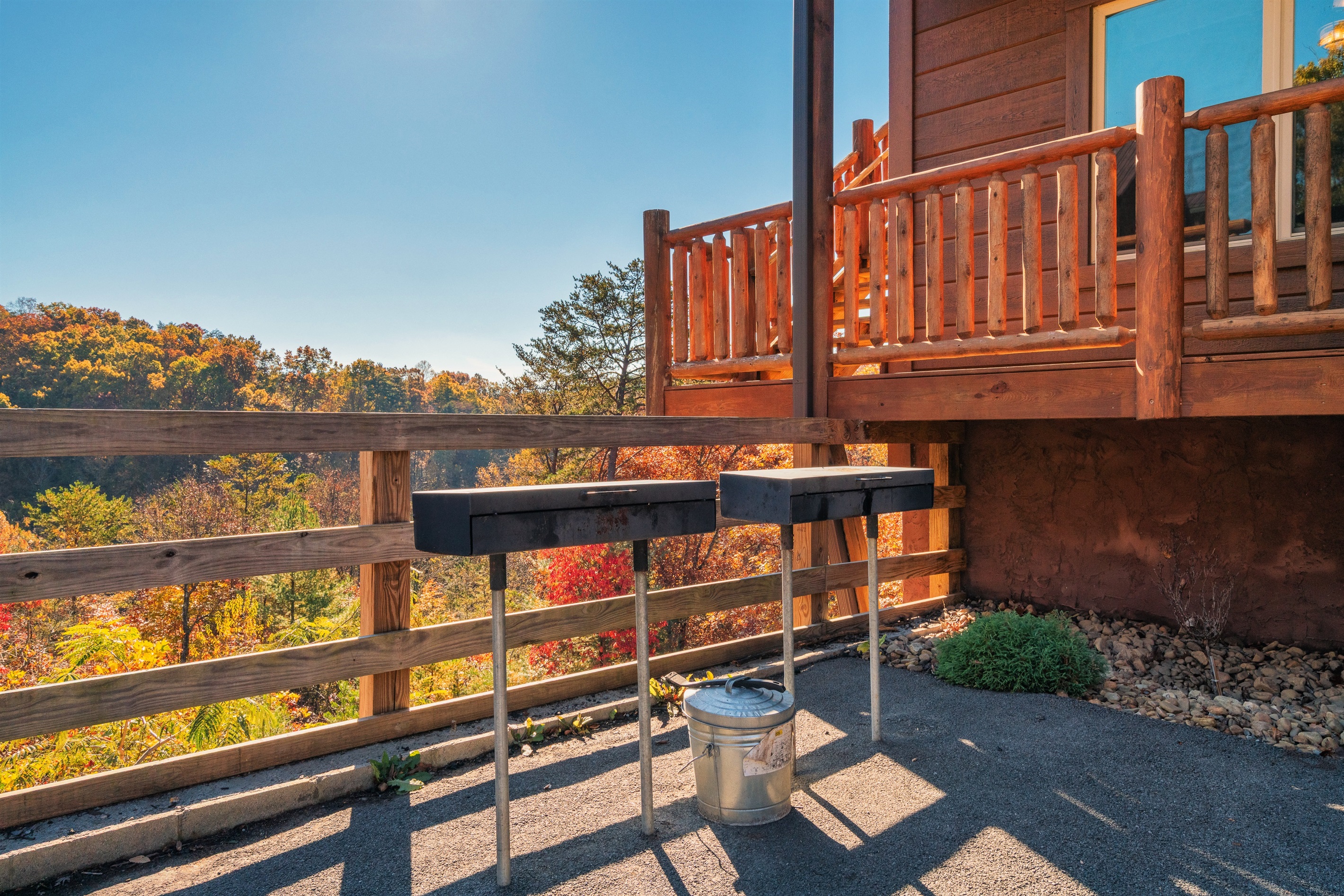 2 charcoal grills can be found at the side of the house