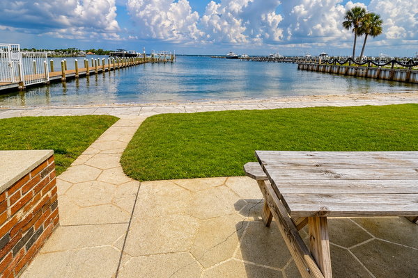 Step outside and enjoy the peaceful bayfront setting, with green space, picnic seating and beautiful water views just beyond the condo.