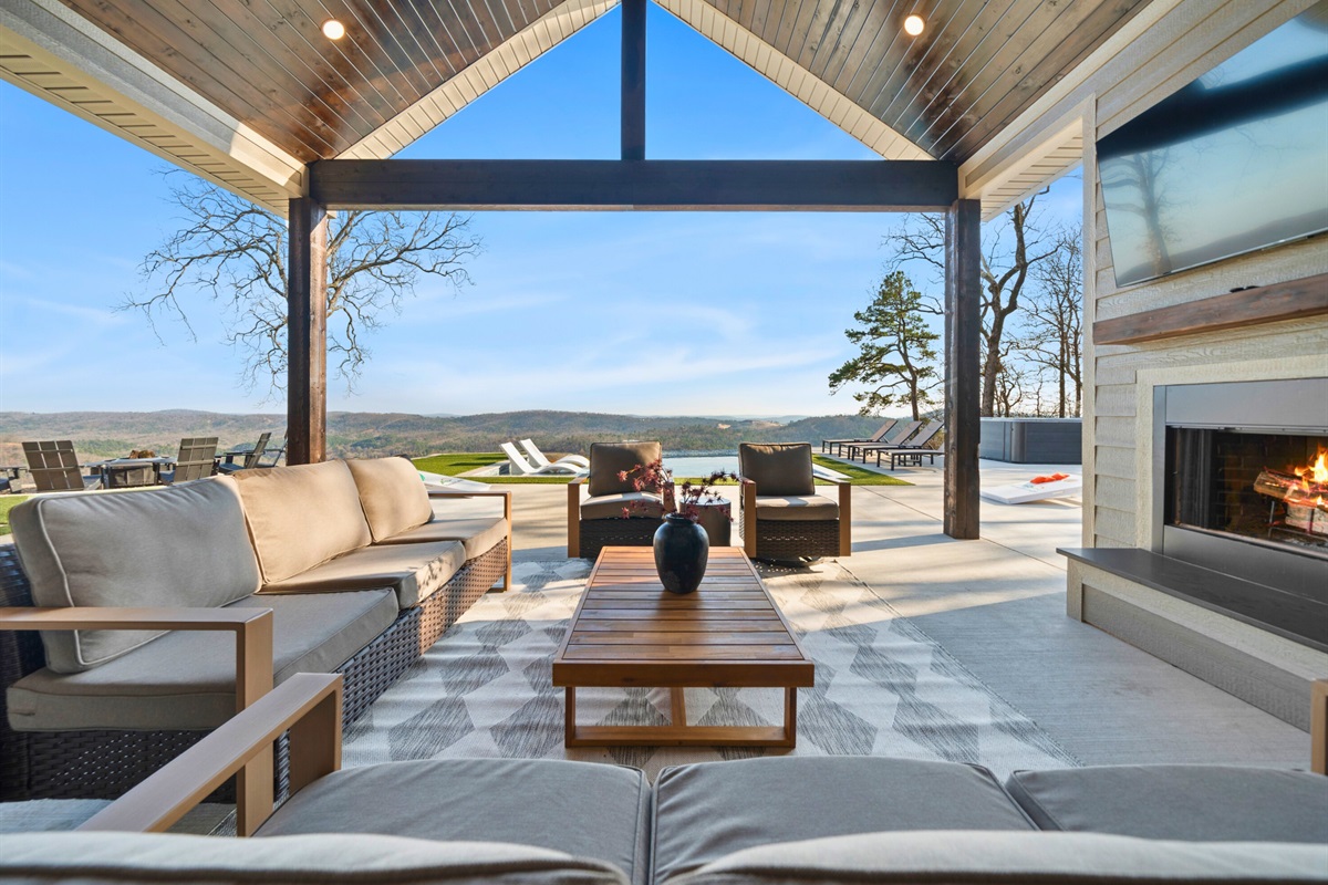 This outdoor living area is designed for gathering, whether you&rsquo;re watching the game on TV or simply soaking in the sweeping views.