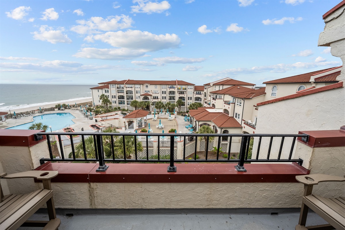 Enjoy resort and ocean views right from your private balcony with comfortable seating
