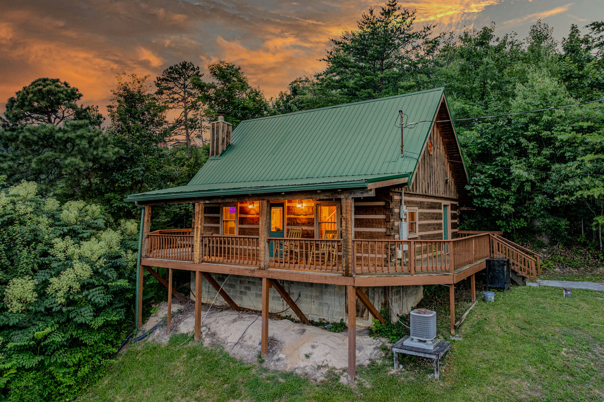 Warm cabin lights welcome you home after a day out