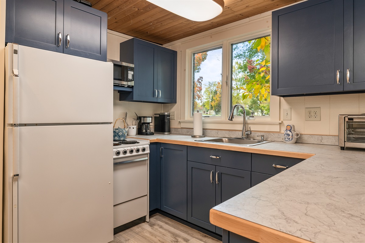 Bright kitchen featuring modern cabinetry and ample counter space.