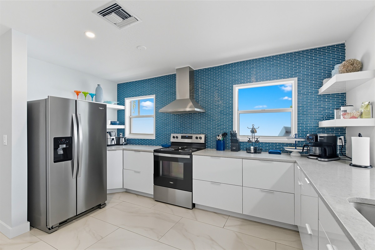 The well-appointed kitchen offers all the appliances and dishes for dining in.
