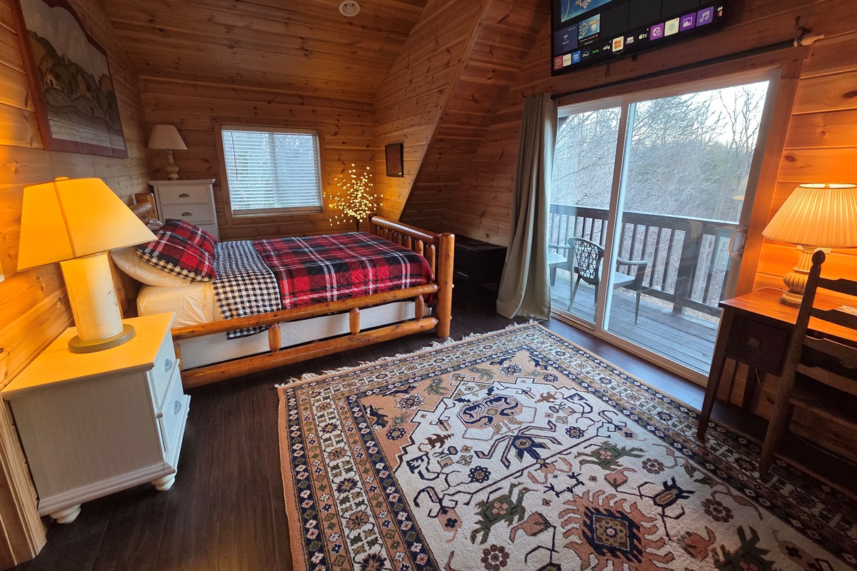 The master bedroom includes a queen-size bed, a Smart TV for streaming, and stunning views that make it the perfect place to relax.