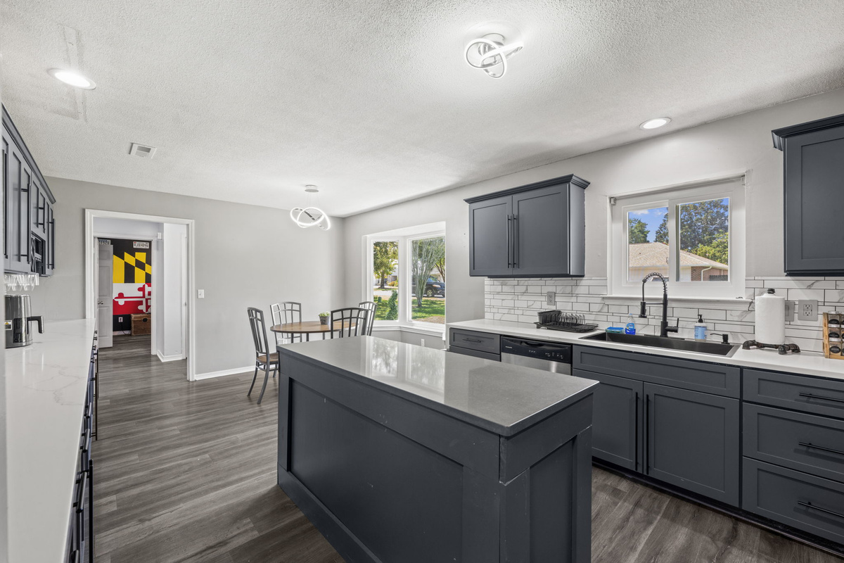 The kitchen flows seamlessly into the breakfast nook, keeping everyone connected while meals come together.