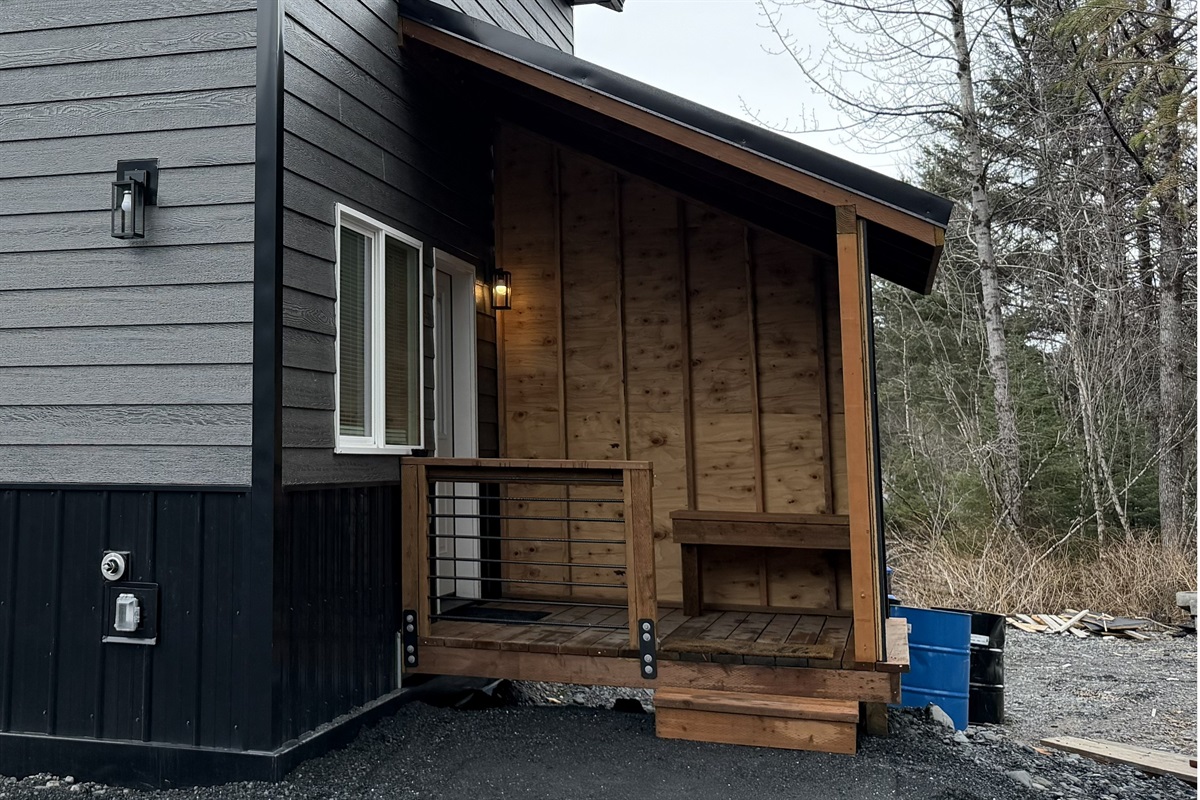 Cabin entrance with covered porch area.  Freezers will be added on the porch.