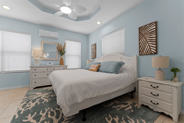 Main Floor King Bed, dresser, double nightstands, smart TV and closet for a comfortable stay.