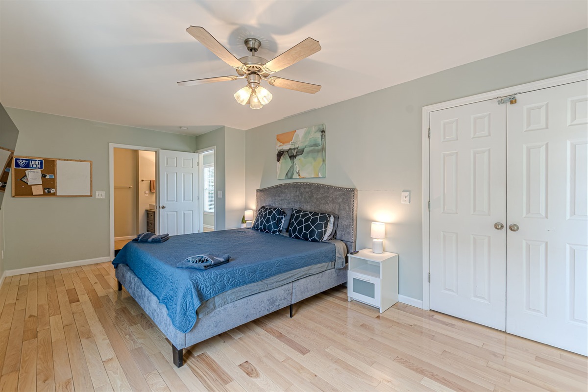 King bed with a view of the luxurious ensuite, perfect for unwinding after a busy day.