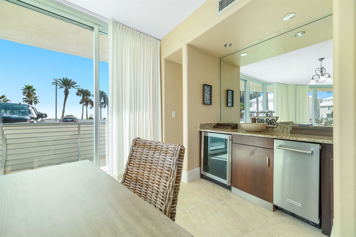 Perfect for entertaining, this dining area features a convenient wet bar with a wine cooler and blender. Create memorable gatherings in this stylish and functional space.