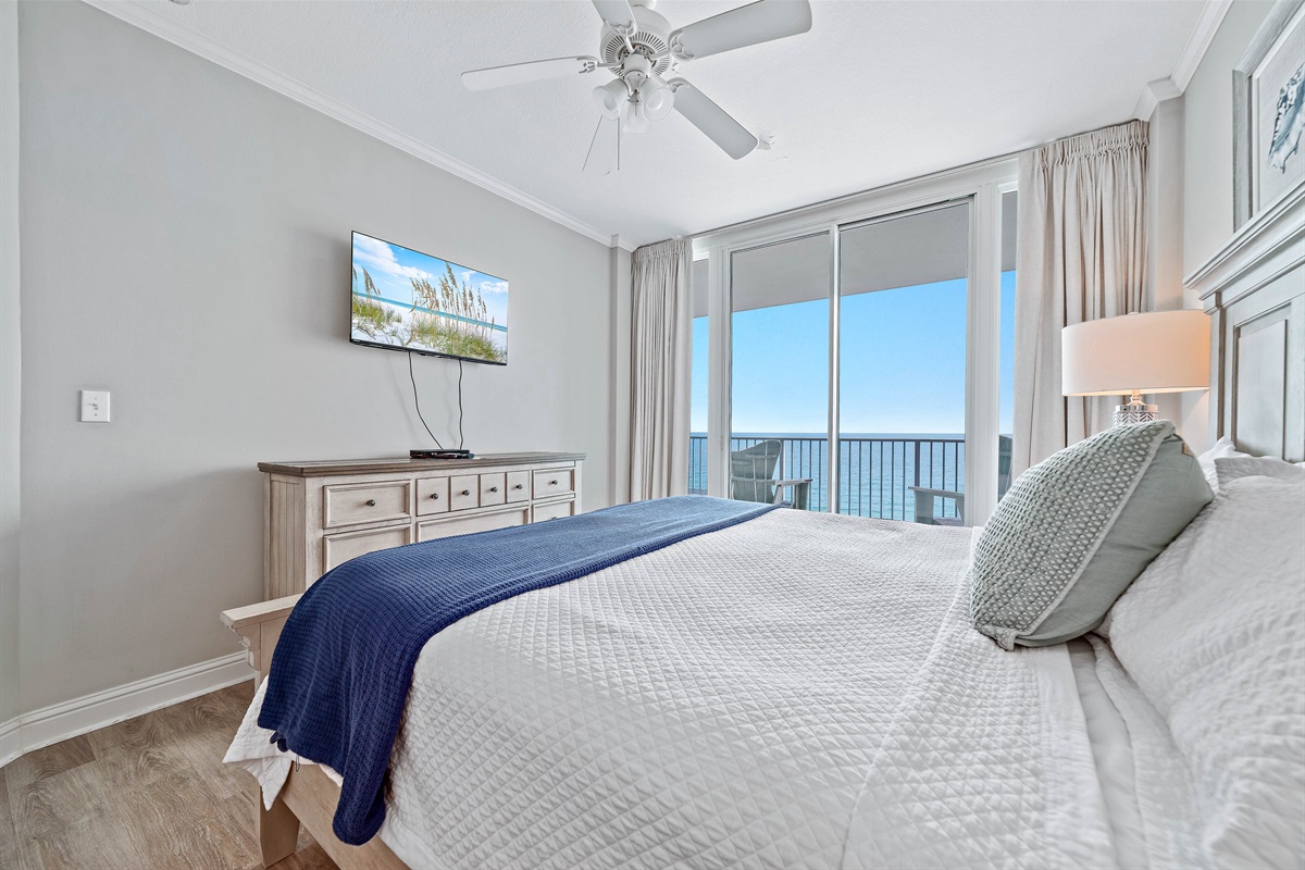 Enjoy the perfect blend of comfort and coastal beauty in this inviting primary bedroom with king-sized bed and direct balcony access and stunning ocean views.