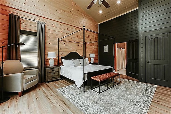 Fall asleep beneath cozy canopy linens and wake to the peaceful glow of the mountains