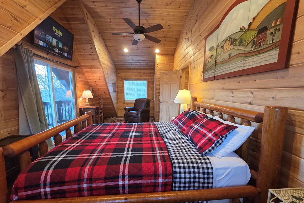 The master bedroom includes a queen-size bed, a Smart TV for streaming, and stunning views that make it the perfect place to relax.