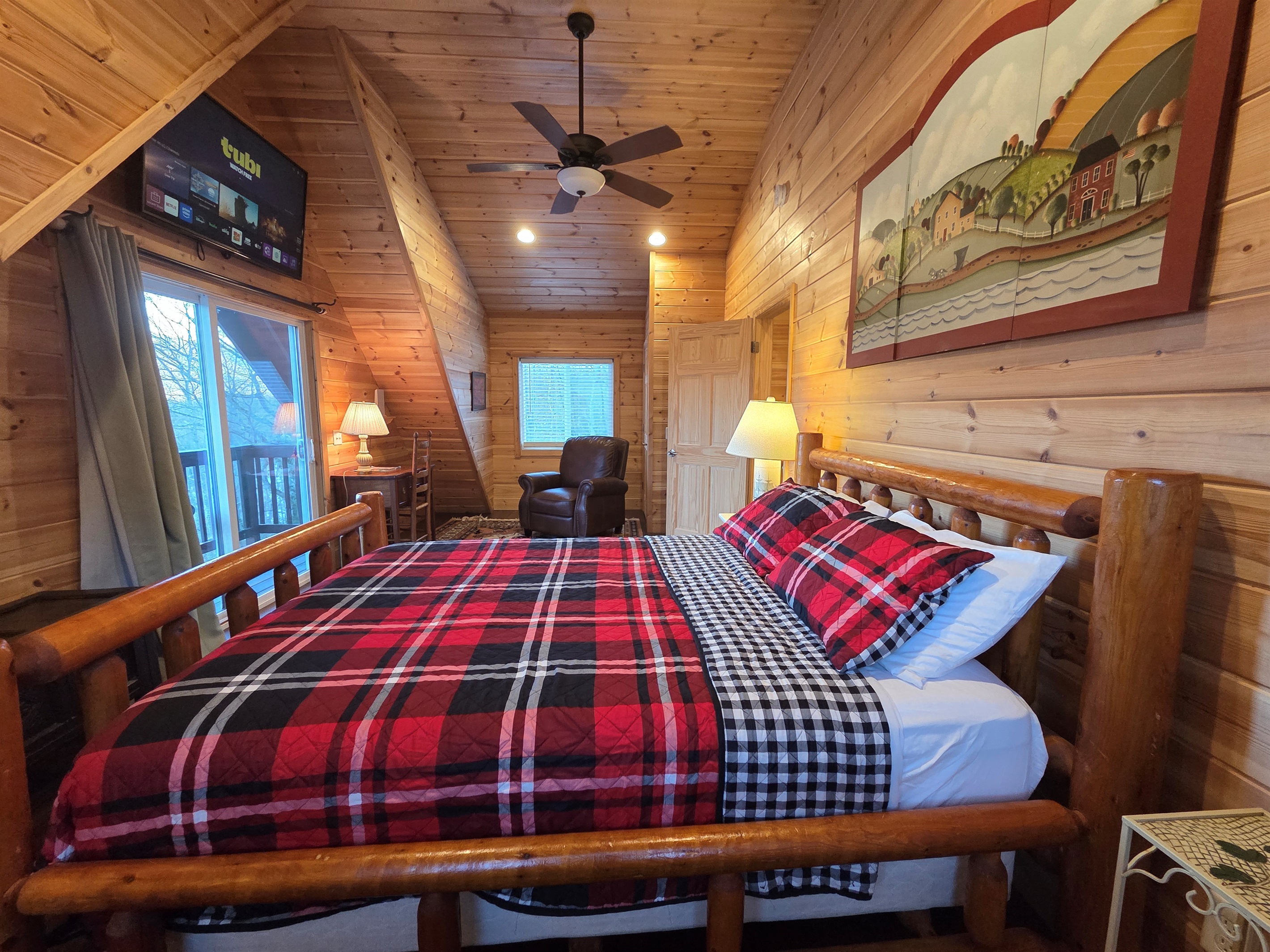 The master bedroom includes a queen-size bed, a Smart TV for streaming, and stunning views that make it the perfect place to relax.