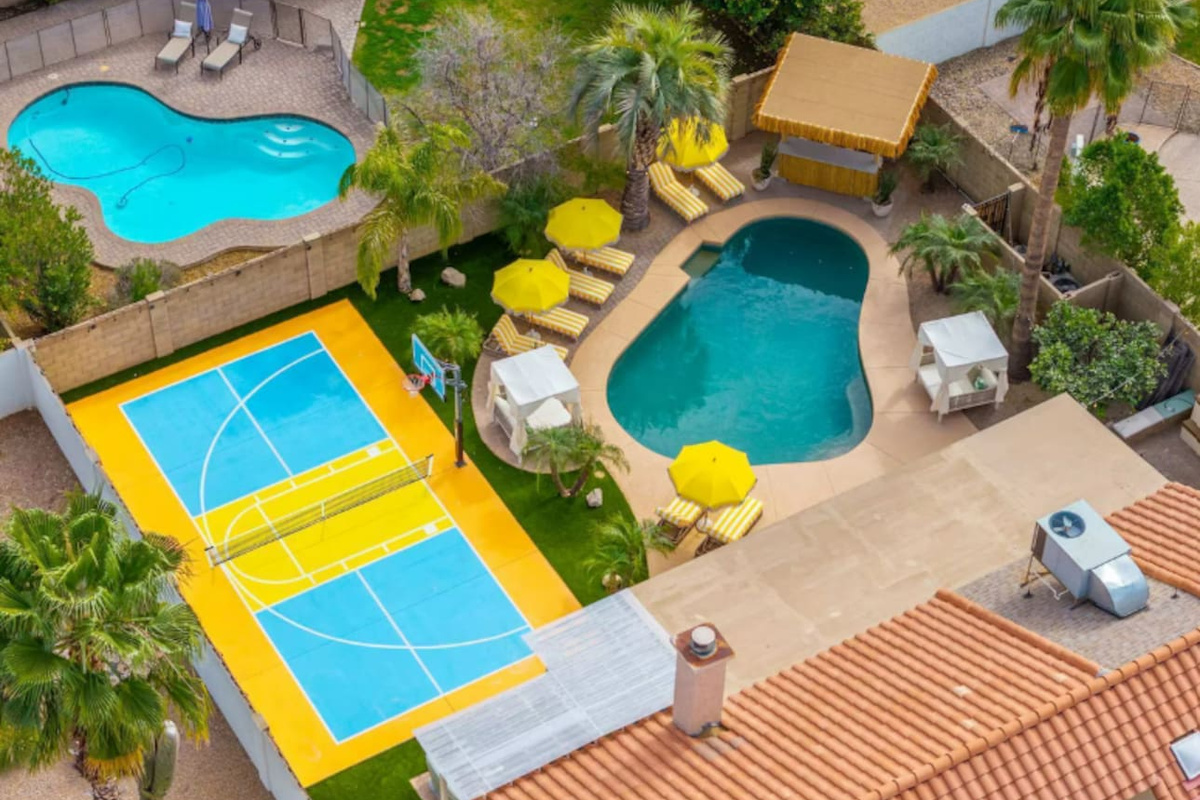 Multiple pools and courts with loungers and umbrellas—ideal for families seeking endless recreation and relaxation options.