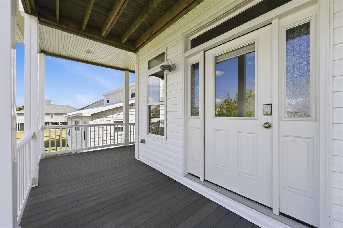 Covered upper-level deck with easy outdoor access and relaxing canal-side views