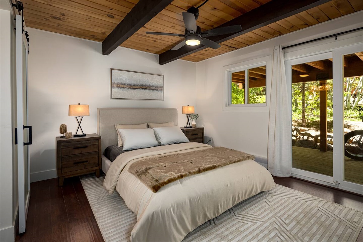 Luxurious master bedroom with en suite, private bathroom and slider out to private deck below.