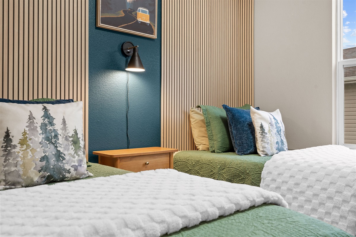 Twin bedroom detail with bedside table