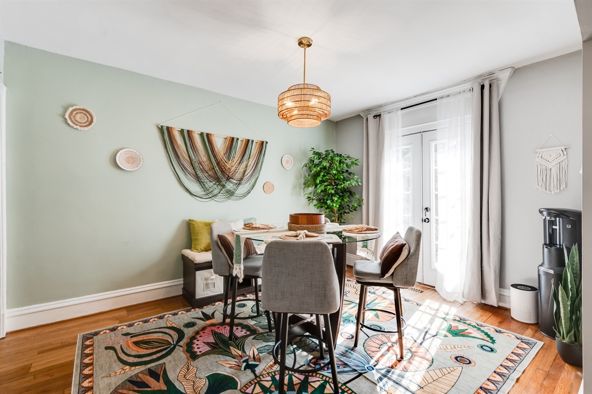 Dining Nook: Gather around a stylish table with vibrant decor and natural light from the patio doors!