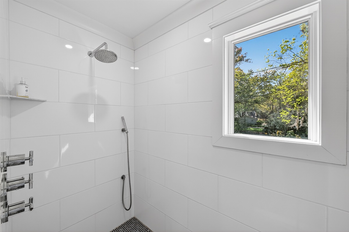 Spacious walk-in shower with clean, spa-like finishes