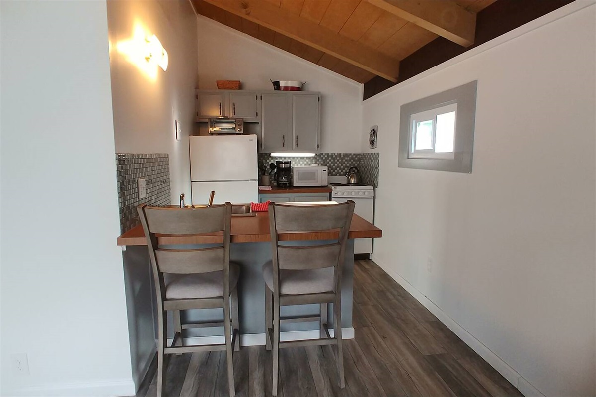 Cozy Kitchen with toaster, microwave, stove& oven. 