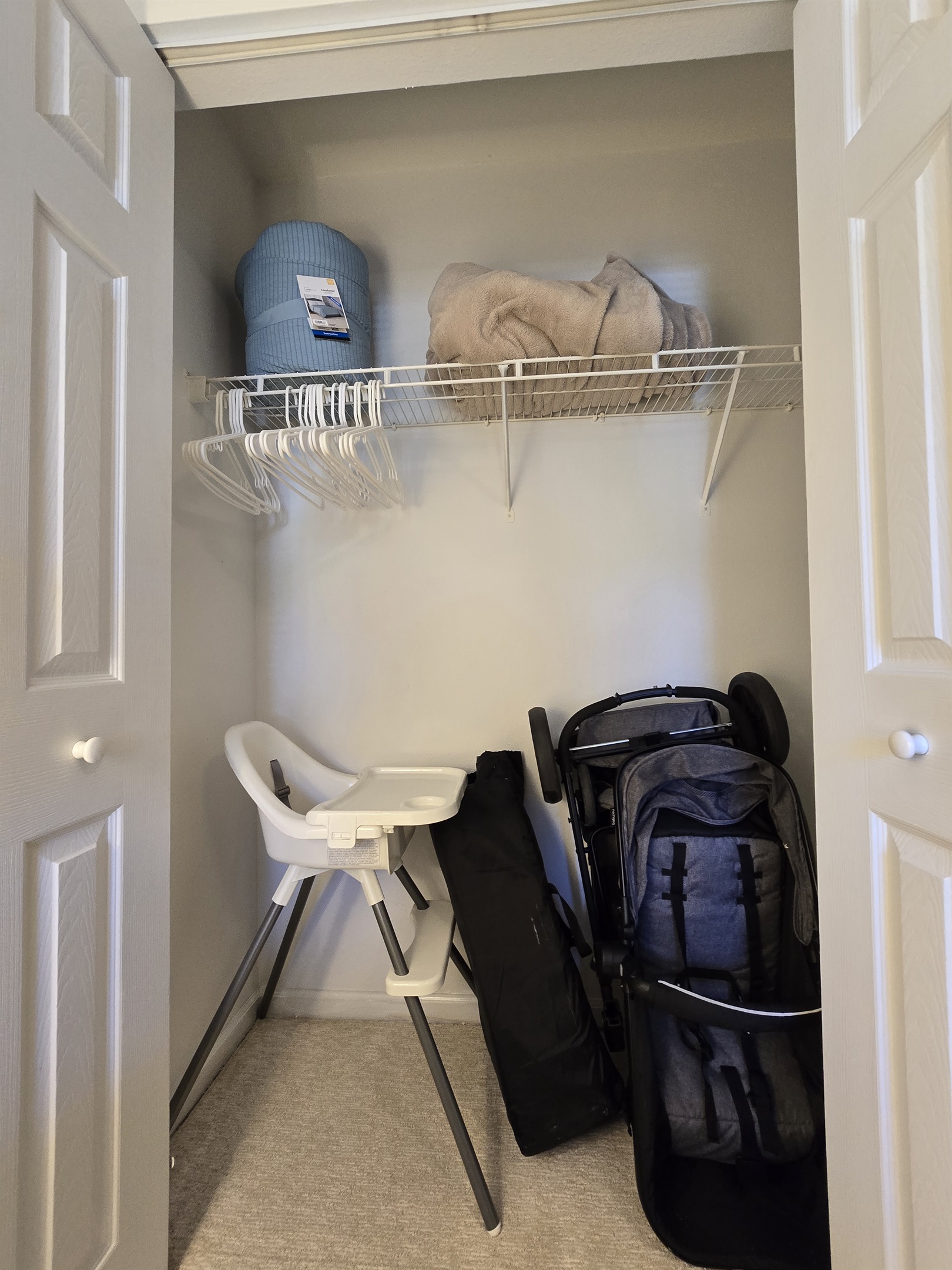 2nd Bedroom Closet with Stroller, High Chair, and Pack n Play for Guest Use