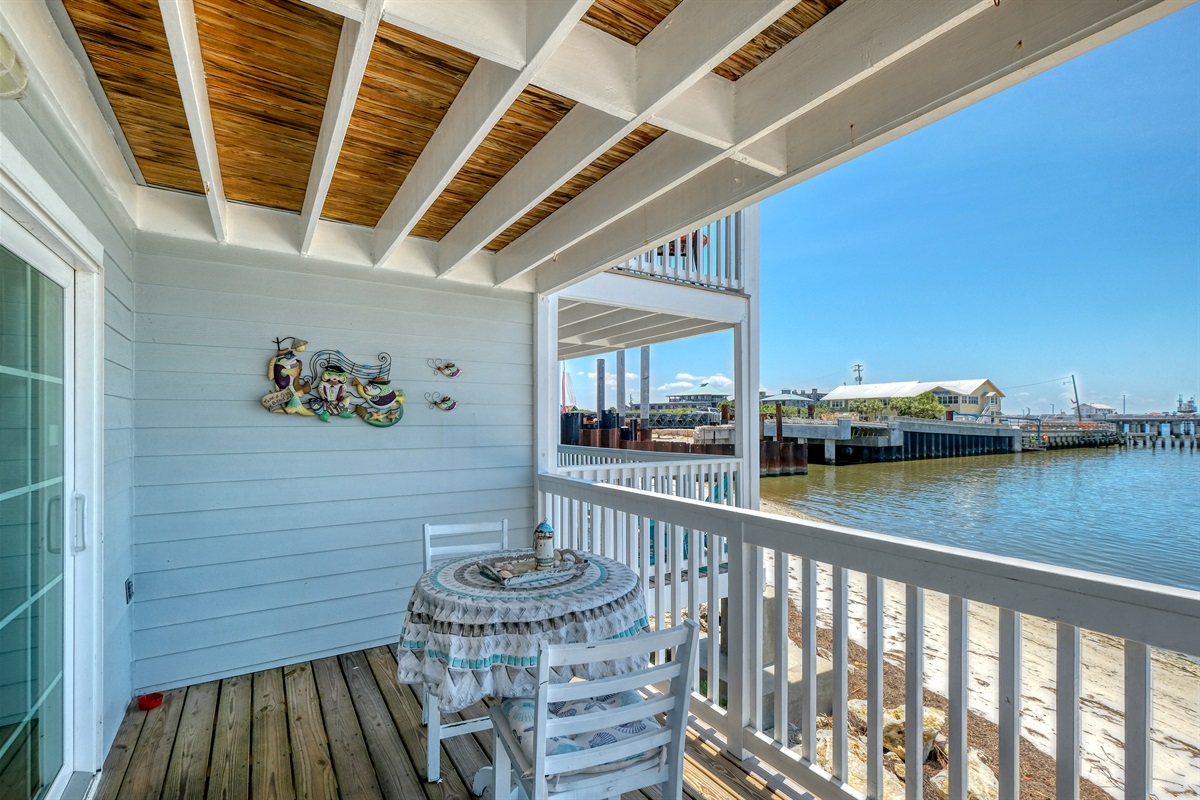 Bistro table and chairs on the porch t enjoy outdoor dining