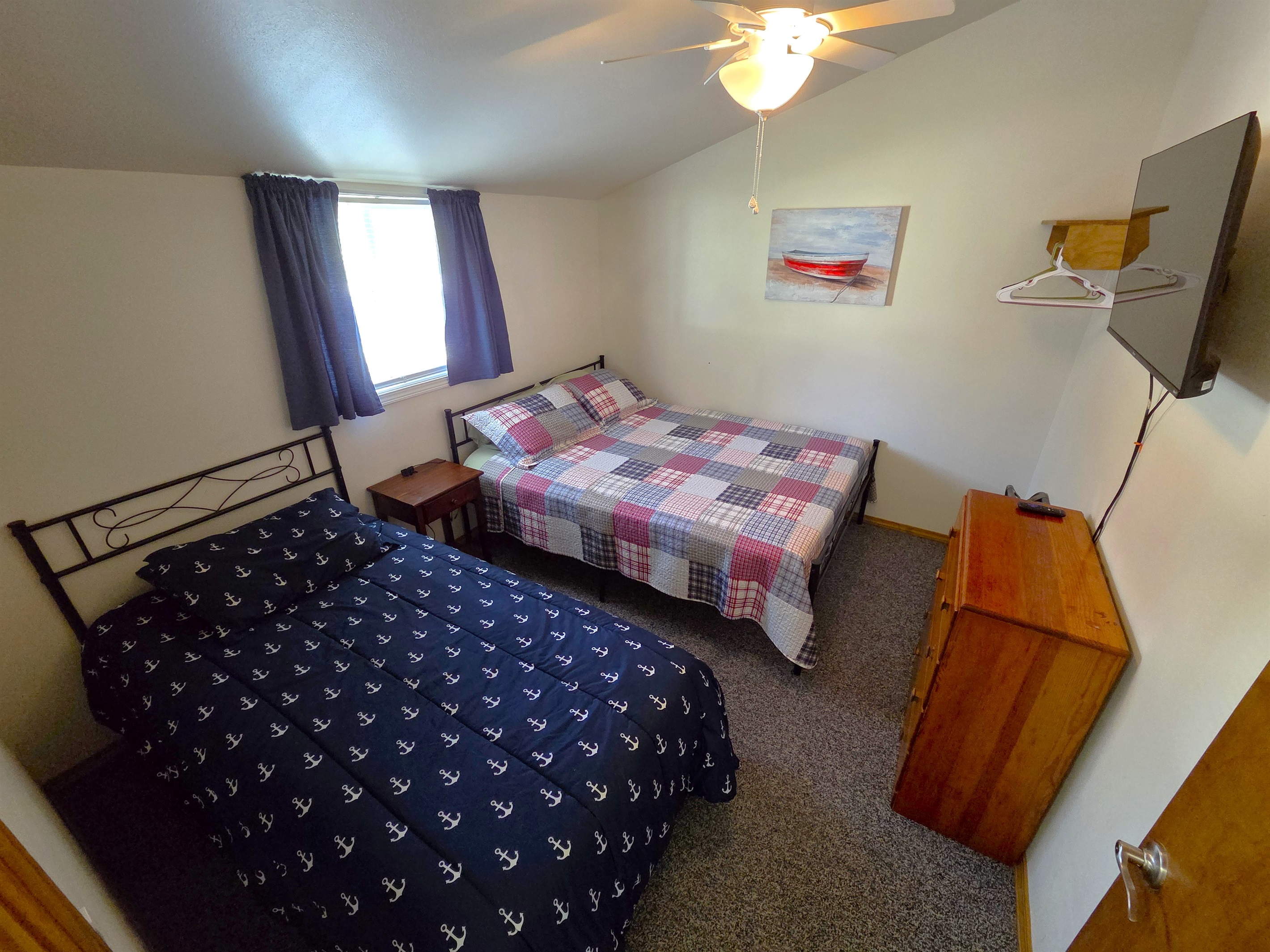 Bedroom 1 features a twin bed, queen bed, vaulted ceiling with ceiling fan, and smart TV.