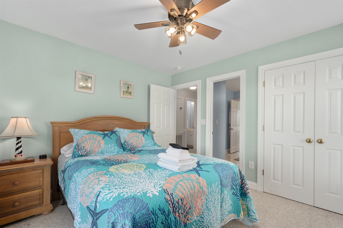 Comfortable queen bedroom perfect for relaxing after a day at the beach.