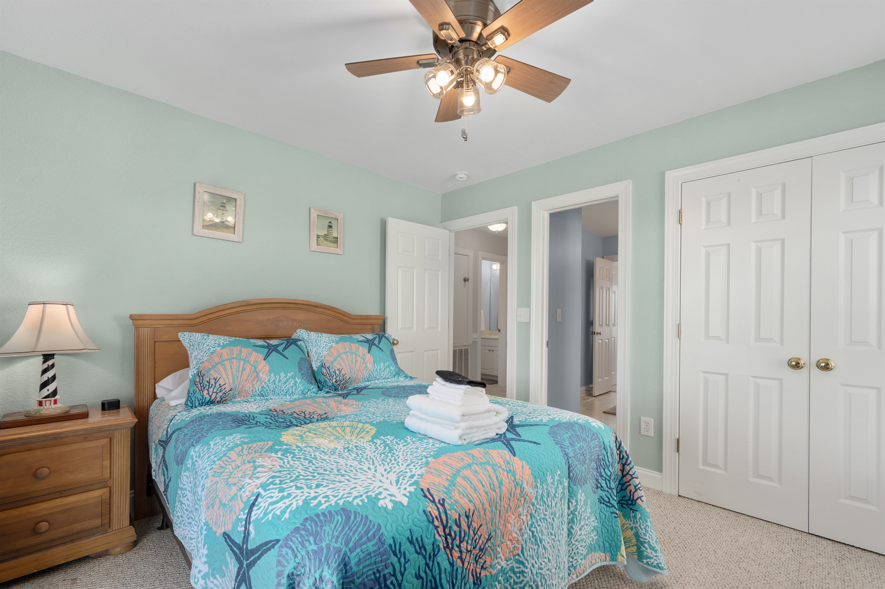 Comfortable queen bedroom perfect for relaxing after a day at the beach.