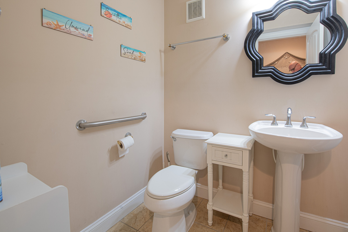 Half Bathroom with Pedestal Sink, Decorative Mirror