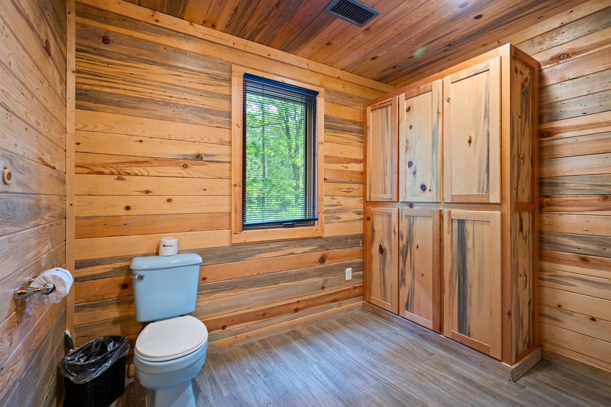 From this angle, the bathroom layout is easy to navigate and includes spacious cabinet for your toiletries