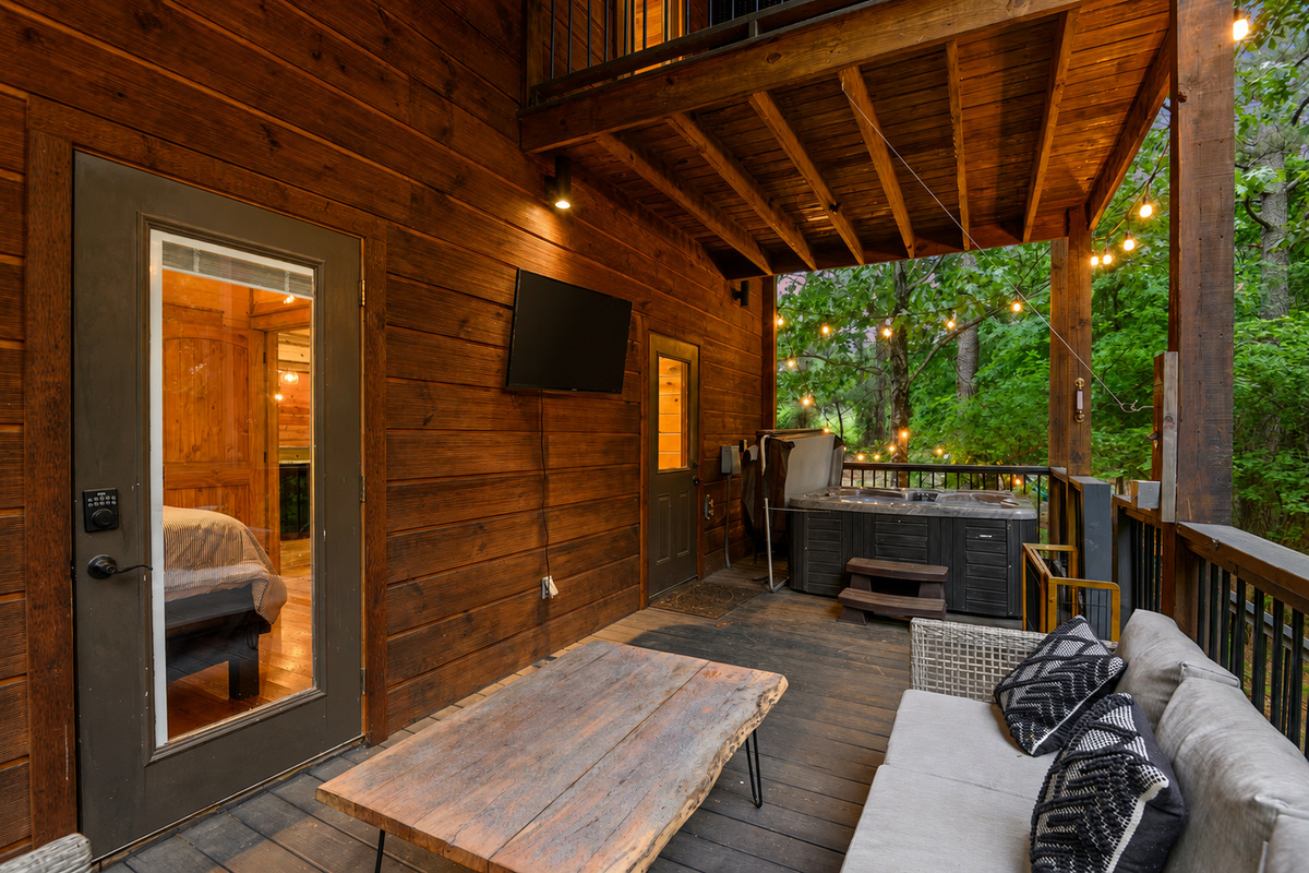 Outdoor Lounge: Unwind in style on the deck with a hot tub and twinkling string lights!